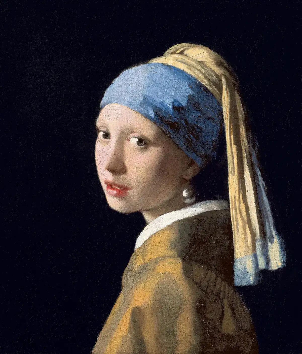 Vermeer's Girl with a Pearl Earring: a girl in a blue and yellow turban looking over her shoulder.
