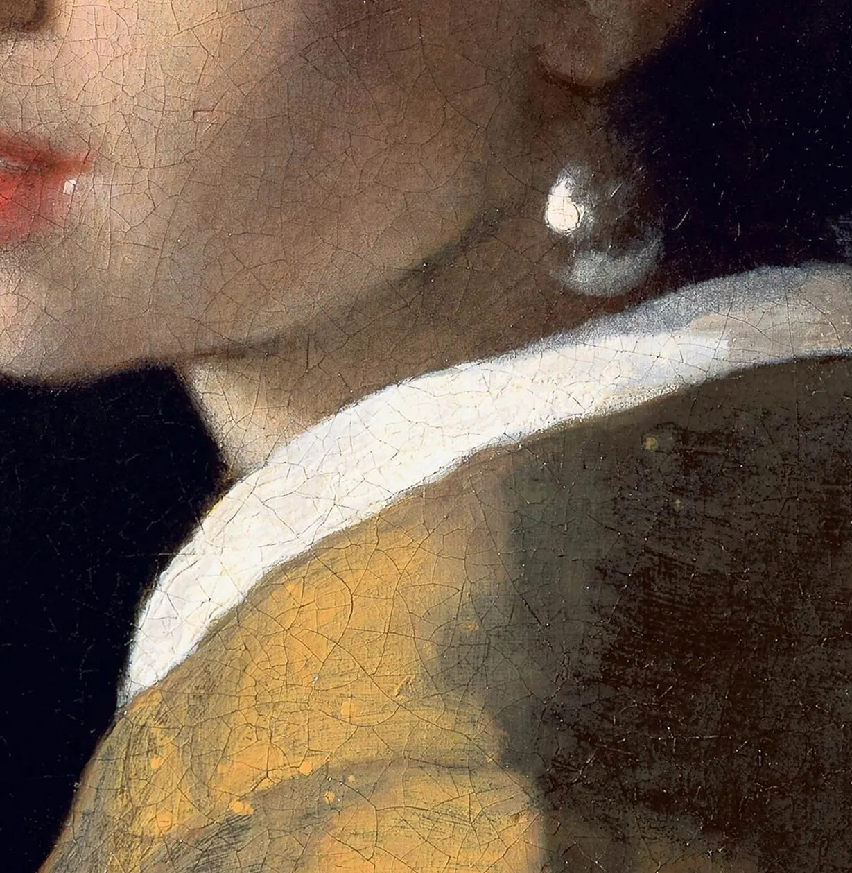 Detail of Girl with a Pearl Earring showing the pearl as two strokes of paint, the white collar, and a fine network of age cracks.