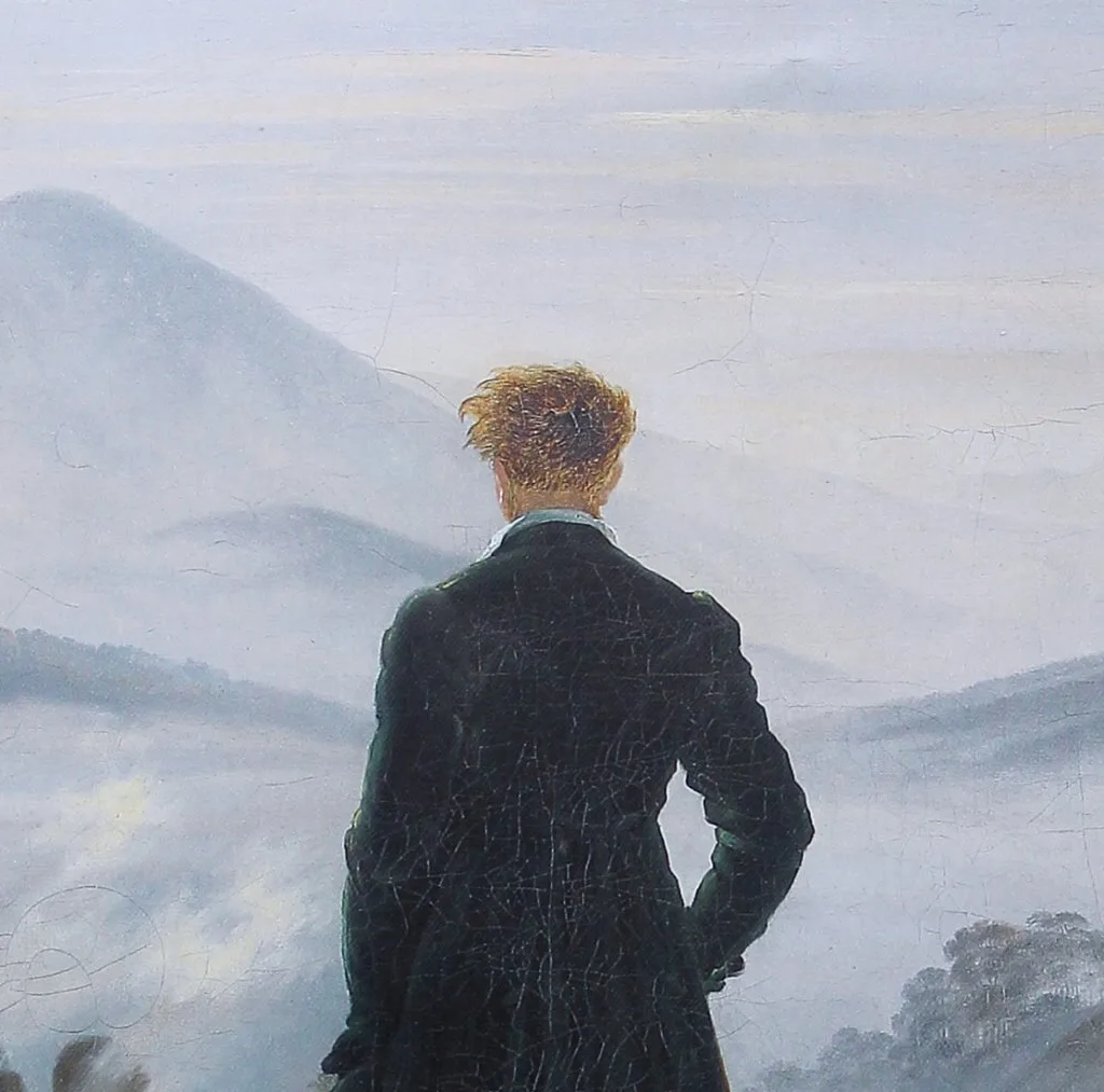 Detail of the figure's back and the fog behind him, showing the smooth gradient from dark coat to pale distant ridges.